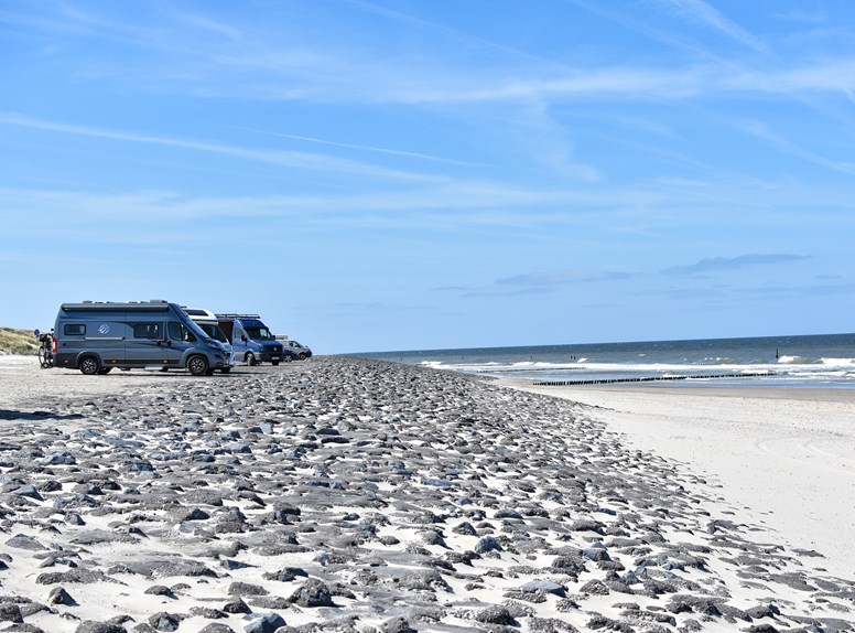 Camper vans near the water